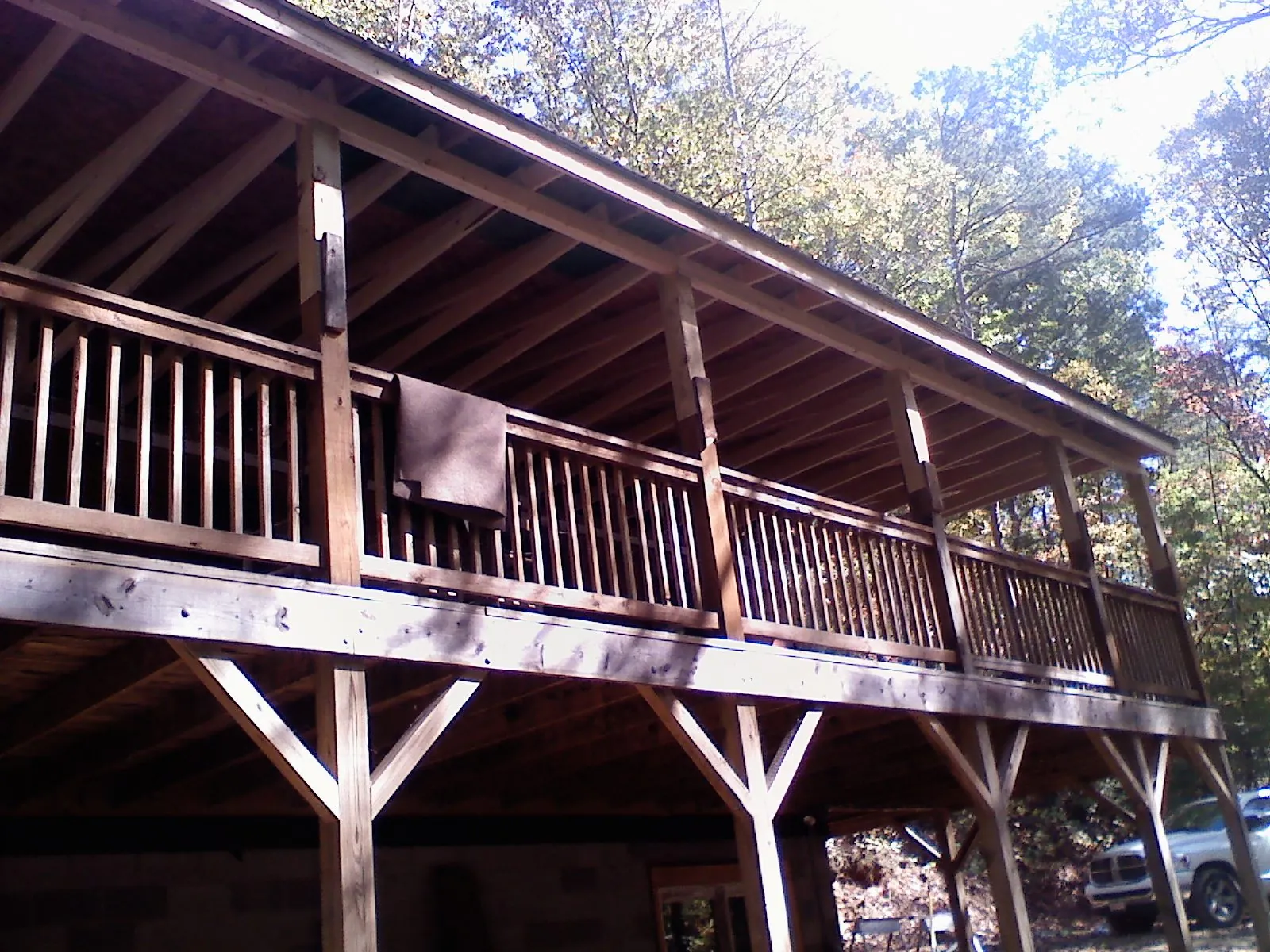 Timber framing under a new elevated porch and deck — Roof Leak Repair in Gaylord by Roofing Brothers